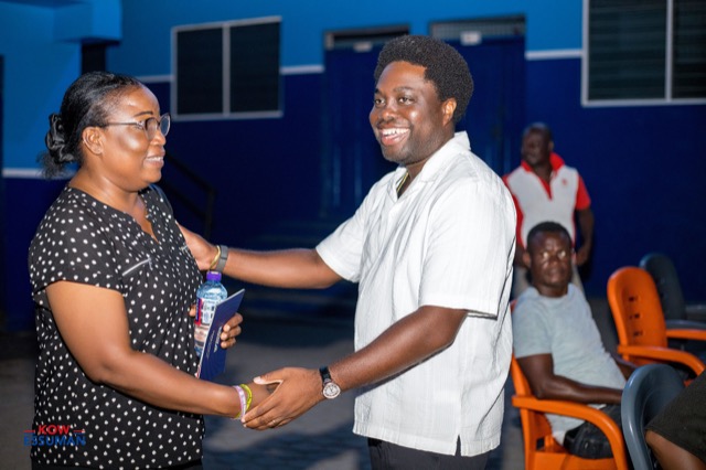 Greeting a resident at the Mpoase meeting